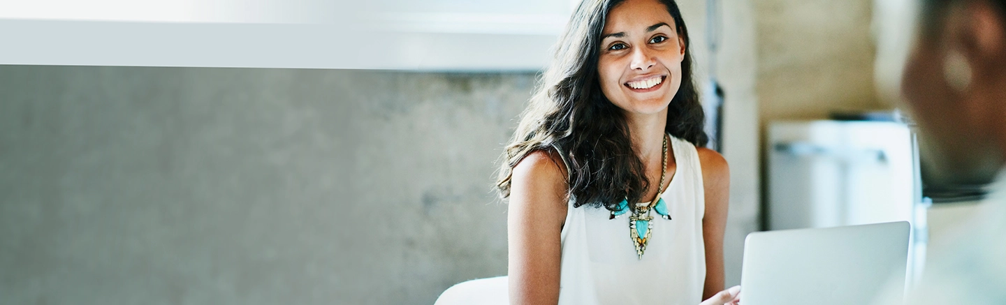 Woman working and smiling in office
