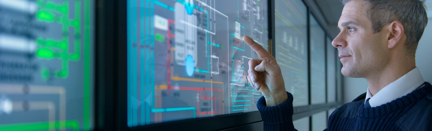 Man using touch screen monitor